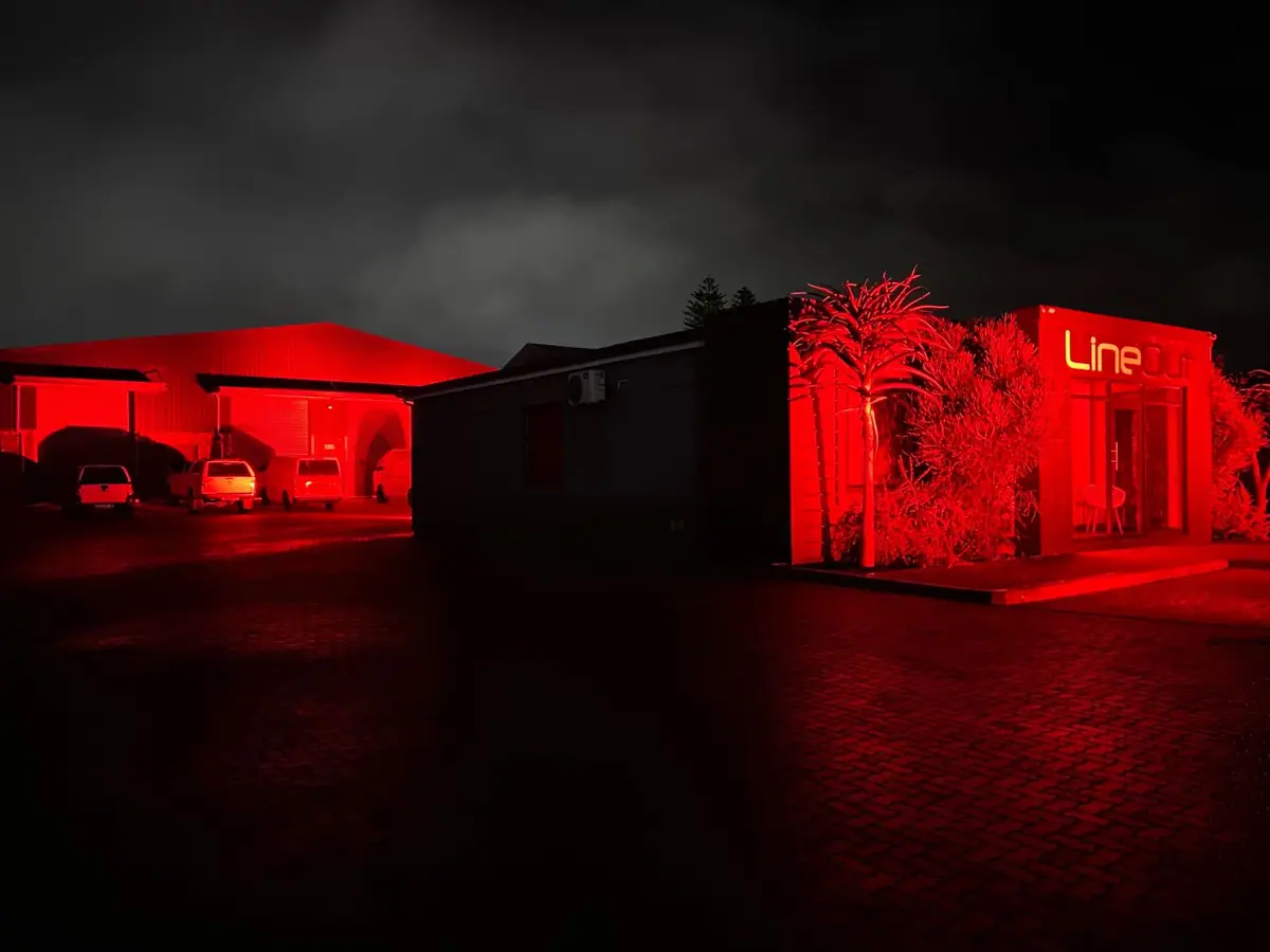 The LineOut building in Newton Park lit red for #LightSARed in 2020