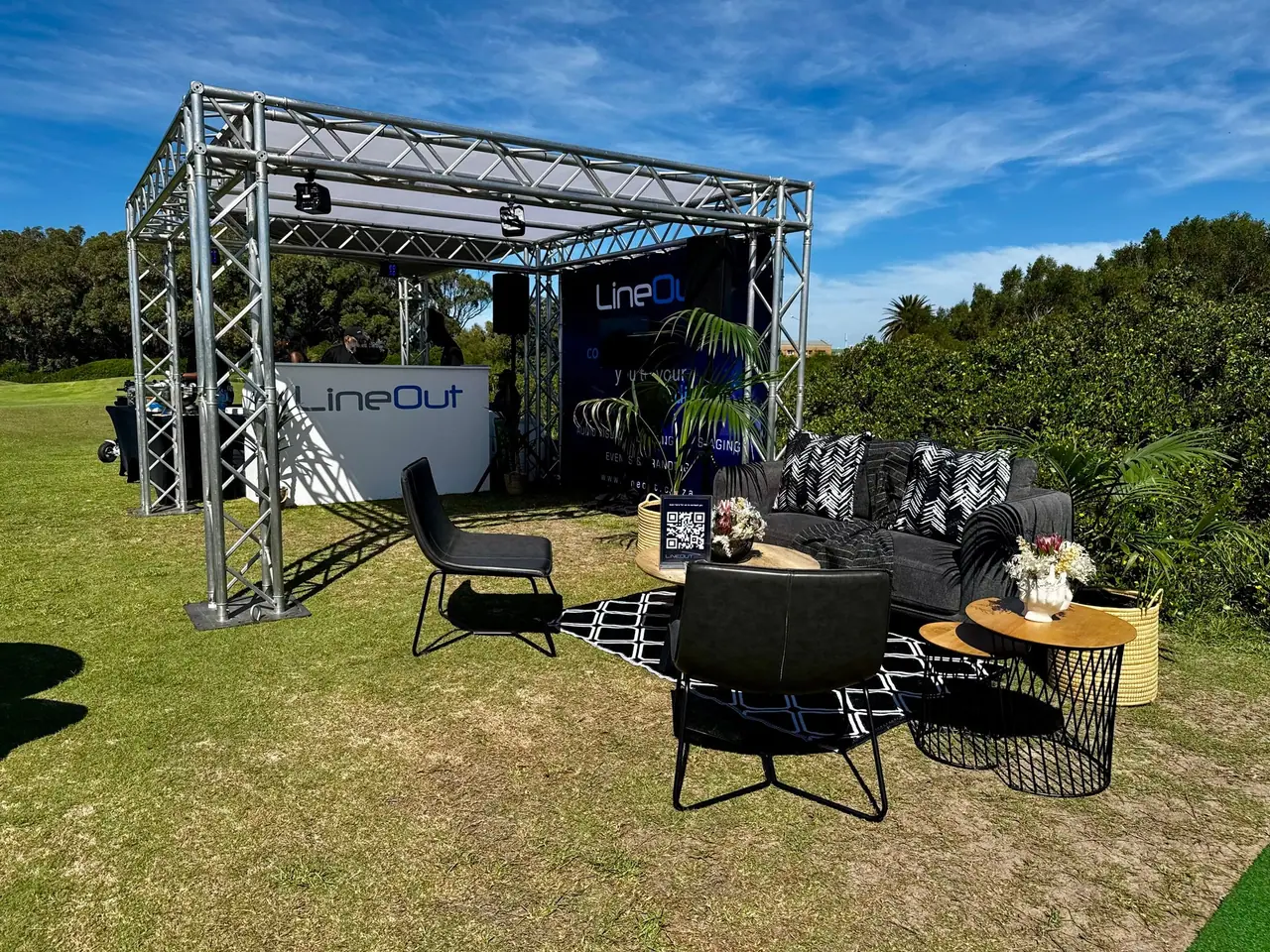 LineOut's "Tee7" lounge at the SAIA Eastern Cape golf day: a truss structure, lounge furniture and LineOut branding on the fairway